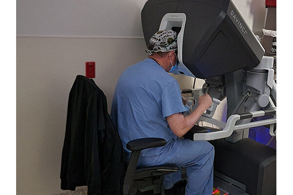 Dr. Fridley at the surgeon console for robotic procedures
